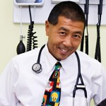  Picture of Dr Goo in a office with medical equipment in the background